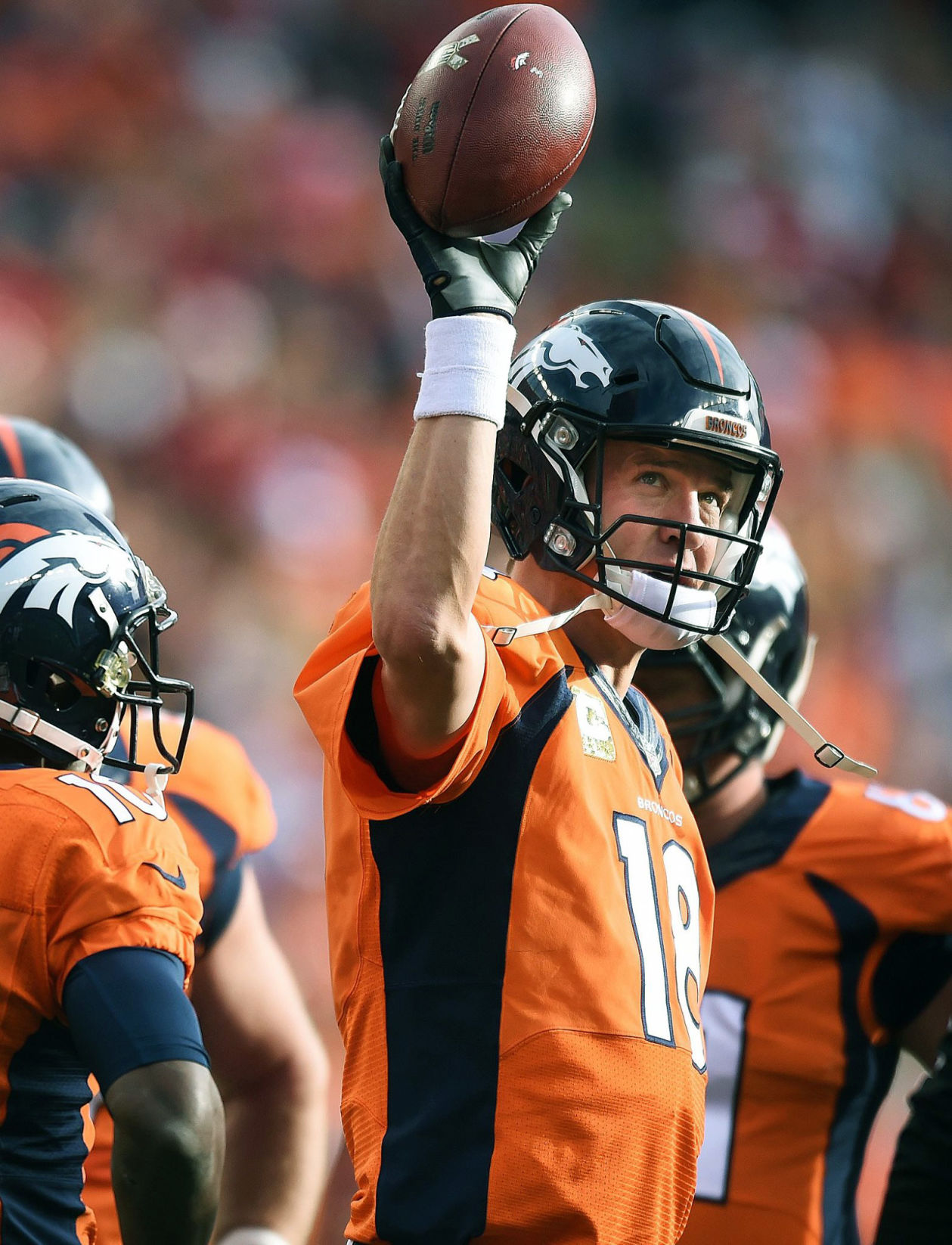 Denver Broncos quarterback Peyton Manning broke the all time passing record with a 4-yard pass in the first inning against the Chiefs. He holds up the ball after breaking the record of Brett Favre of 71,838 yards. The Denver Broncos played the Kansas City Chiefs at Sports Authority Field at Mile High on Sunday, November 15, 2015. The Broncos lost the game 29-13. (Jerilee Bennett/The Gazette)